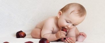 baby eating fruit