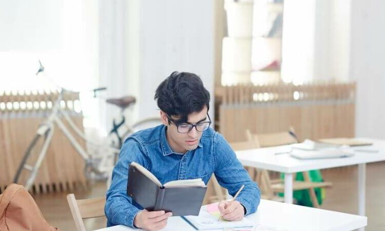 Boy doing paper work